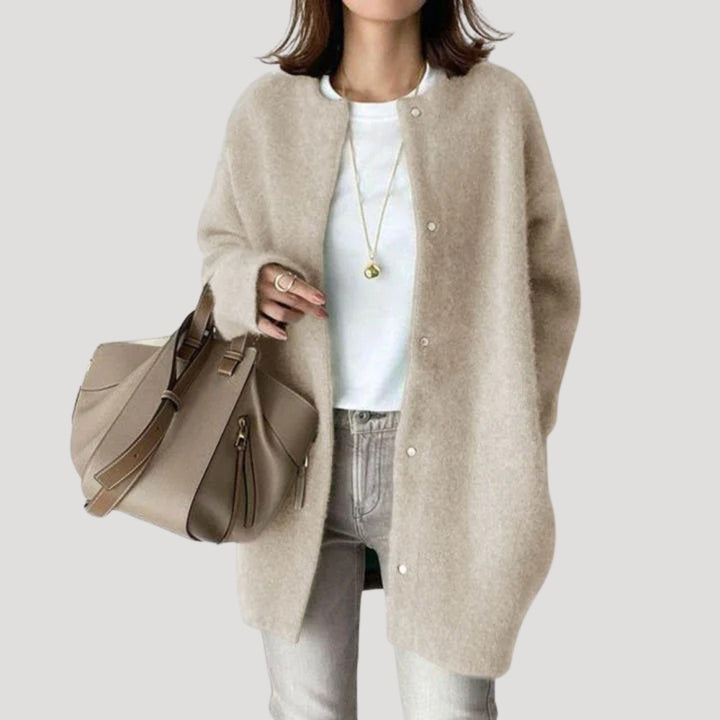 Women's oversized spring jacket fastened with snaps