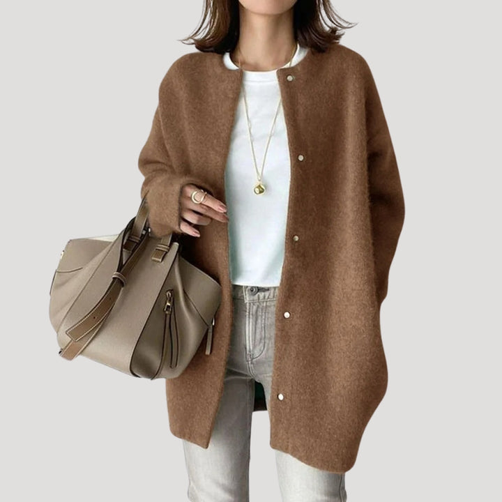 Women's oversized spring jacket fastened with snaps