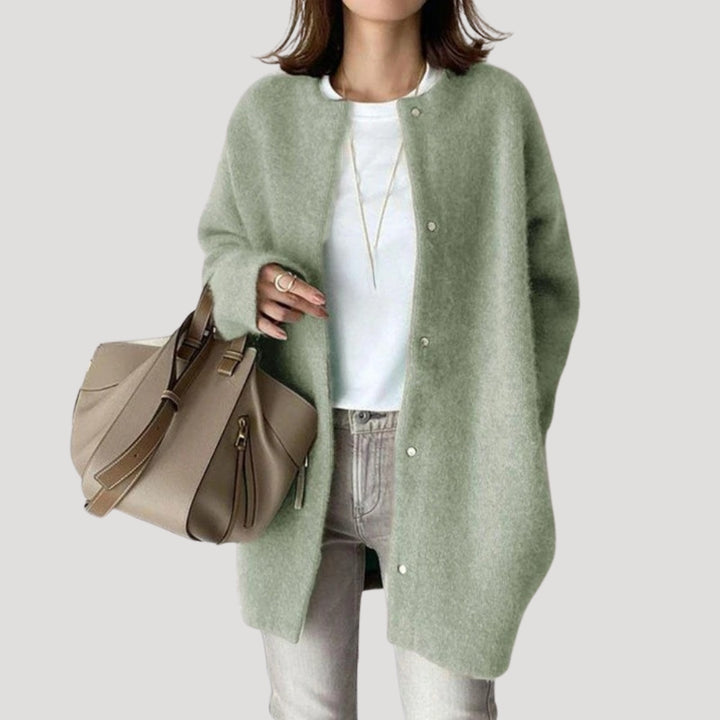 Women's oversized spring jacket fastened with snaps