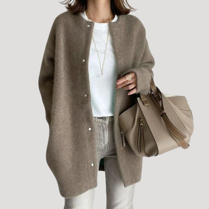 Women's oversized spring jacket fastened with snaps