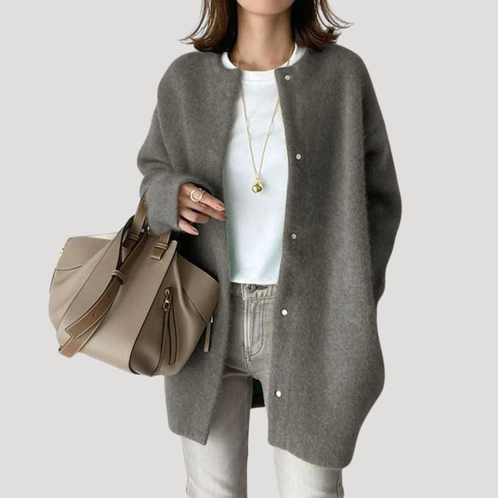 Women's oversized spring jacket fastened with snaps