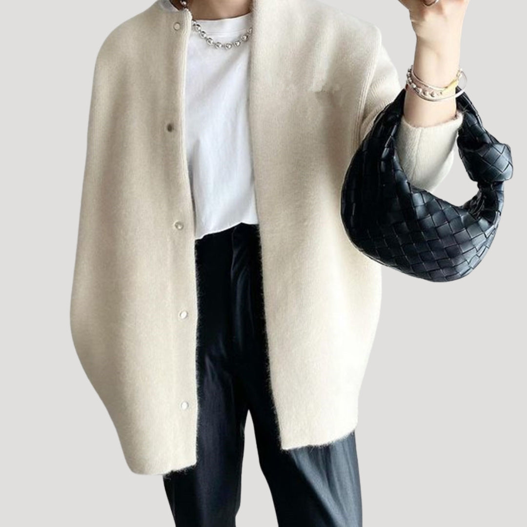 Women's oversized spring jacket fastened with snaps