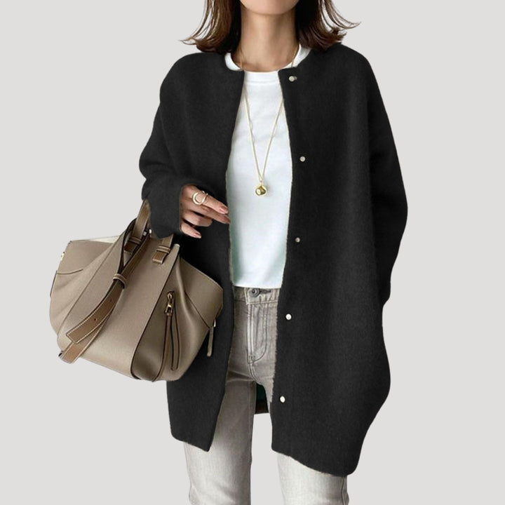 Women's oversized spring jacket fastened with snaps